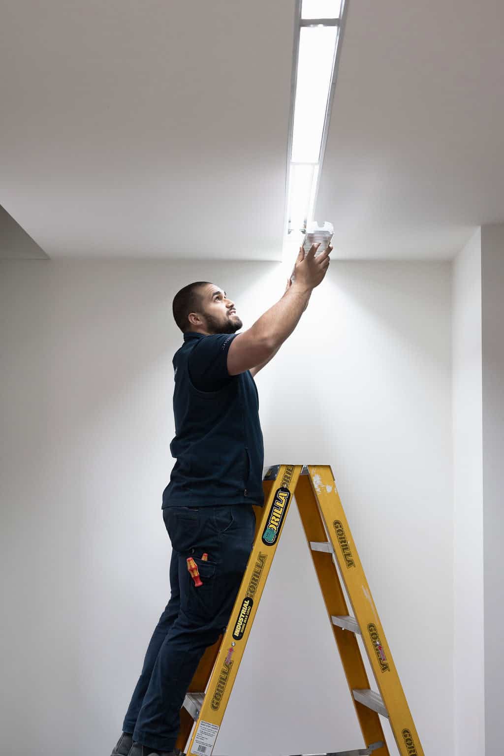 Expert electrician installing sophisticated lighting in Malvern Victorian mansion